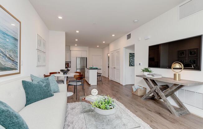 a living room filled with furniture and a bed