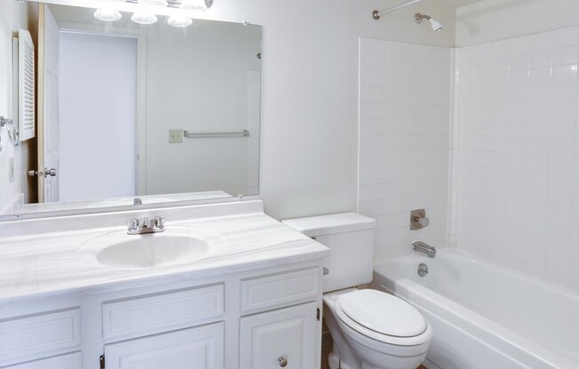 a bathroom with a sink toilet and a tub