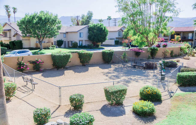 the backyard of a house with a garden and a fence