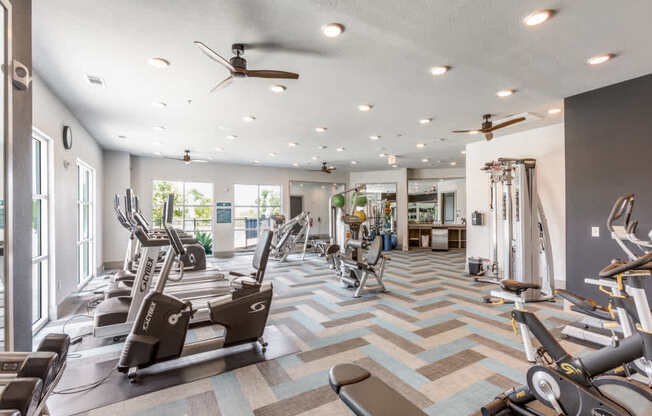 A spacious gym with a variety of exercise equipment.