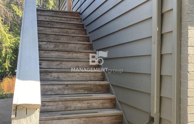 Spacious Multnomah Village Duplex sits amongst a treetop setting. Fenced Backyard. Landscaping Included!