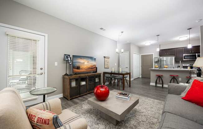 a living room with a couch and a table with a television