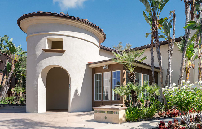 a house with a fountain in front of it
