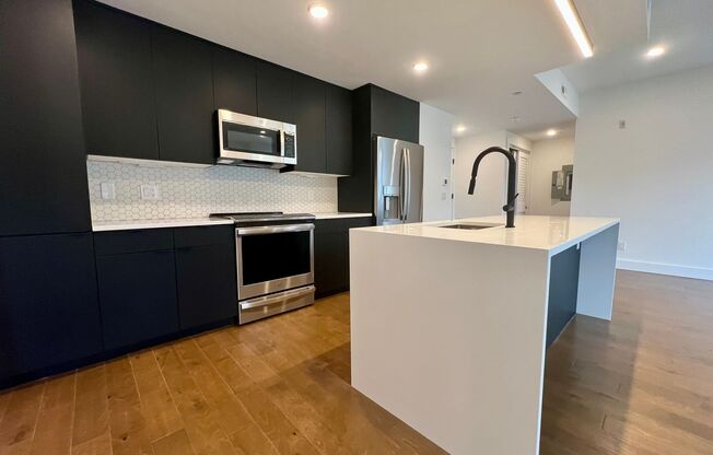 Stunning 2-Bed/2-Bath Condo with One-Car Garage and Rooftop Deck! Available NOW!