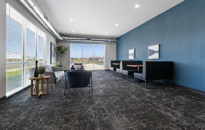 A room with grey carpet and blue walls.