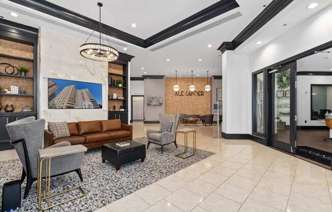 a living room with a couch and chairs in a lobby