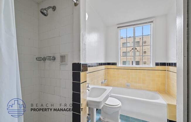 a bathroom with a tub and a sink and a window