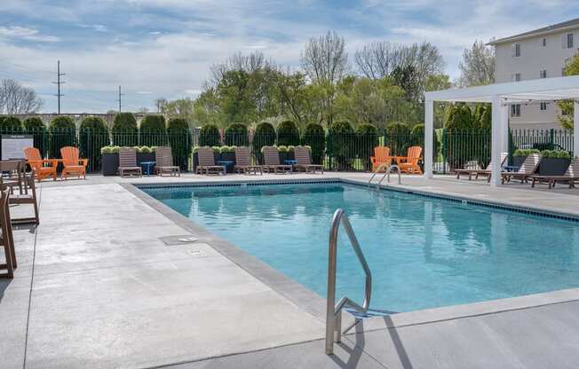 our apartments have a large pool and lounge chairs