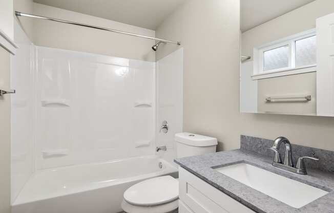 a bathroom with a sink toilet and a shower