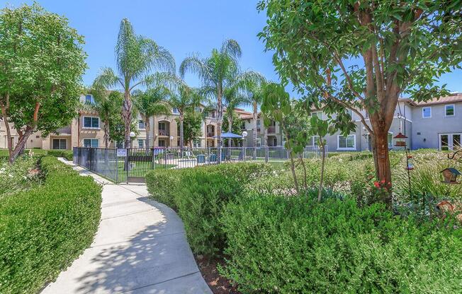 a house with bushes in front of a building