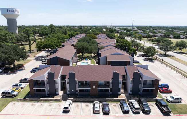 A large building complex with a water tower in the background.