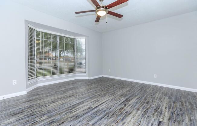 a bedroom with a large window