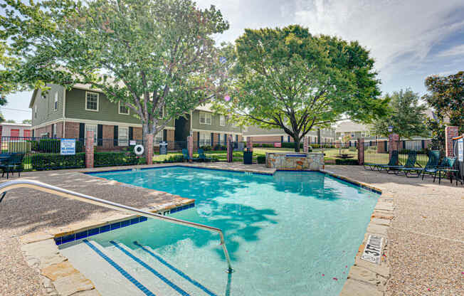 main pool with lounge chairs  at Arbors Of Cleburne, Cleburne, TX