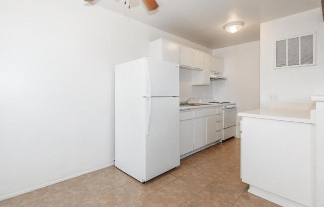a large white refrigerator in a kitchen