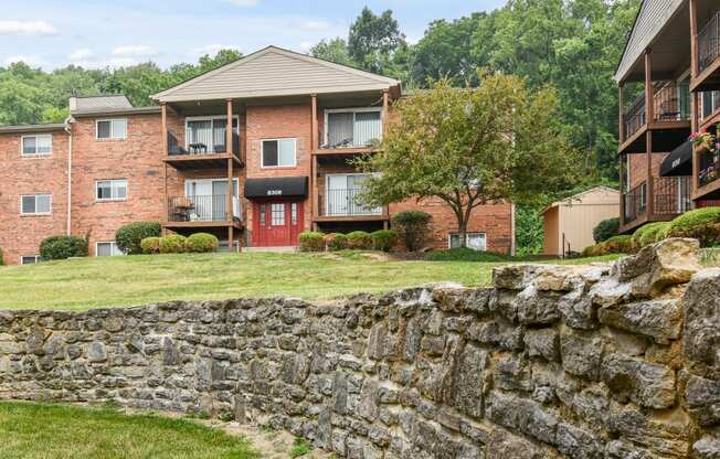 Stone wall outside in the spacious lawn at Heritage Hill Estates Apartments, Cincinnati, Ohio 45227