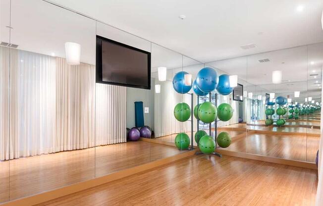 a bowling party room with balloons and a tv