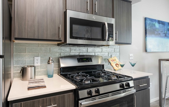 a kitchen with a stove and a microwave