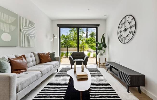 a living room with white walls and a sliding glass door at Hydro, Richmond, VA, 23224