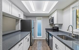 2 bed 1.75 bath - includes water/sewer/garbage and parking included in rent.