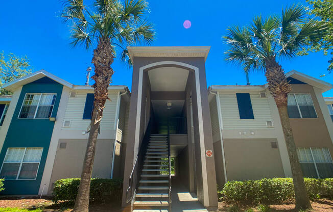 Apartment building exterior with palm trees