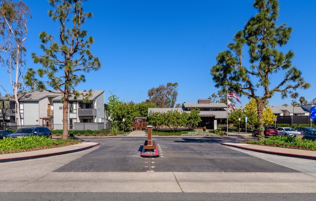 A street view of a residential area with a clear blue sky.