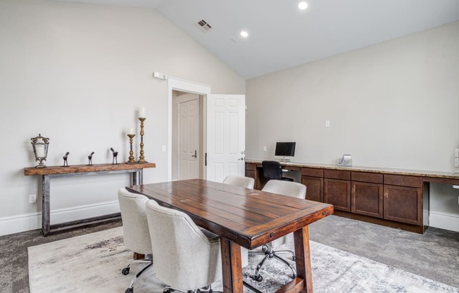 a conference room with a wooden table and chairs