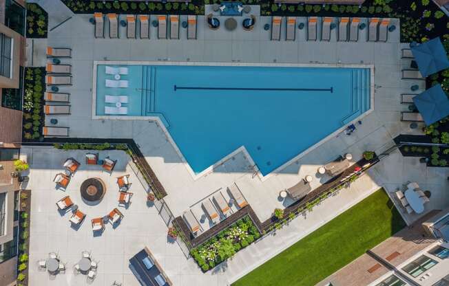 arial view of a resort style pool with lounge chairs and a fountain at The Griffin Royal Oak, Royal Oak, Michigan