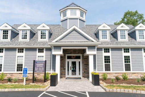 the front of the apartment building with a leasing sign at Merion Milford Apartment Homes, CT 06460