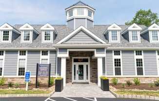 the front of the apartment building with a leasing sign at Merion Milford Apartment Homes, CT 06460