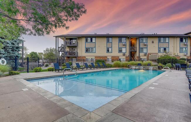 a house with a pool outside of a building