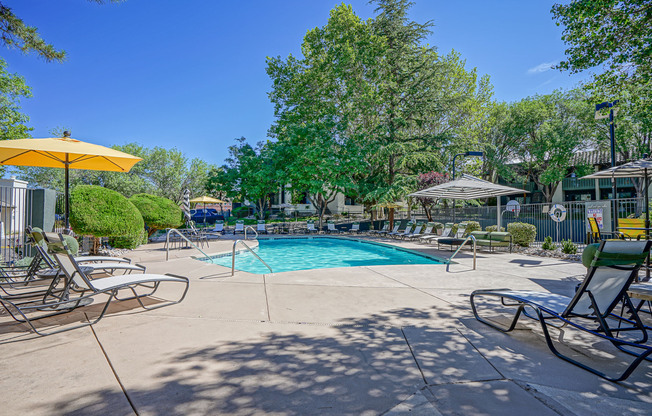 Poolside lounge with resort-style furniture at Treehouse Apartments in Albuquerque, New Mexico