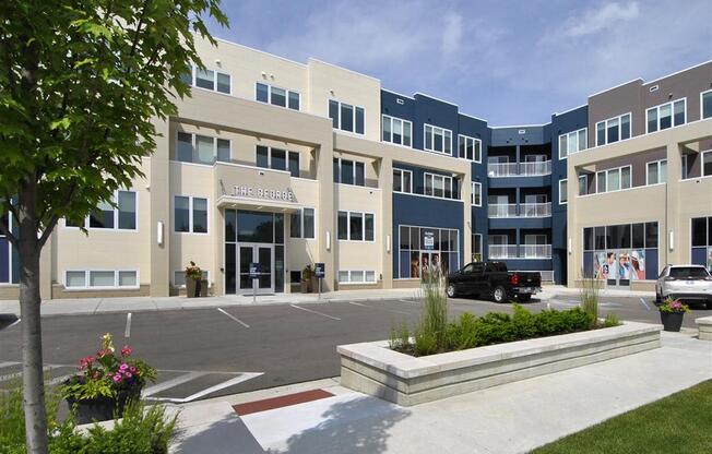 a building with a parking lot in front of it