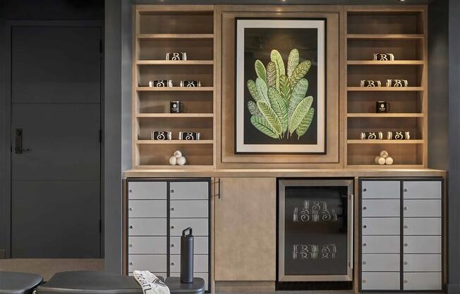 a room filled with furniture and a large painting of a plant