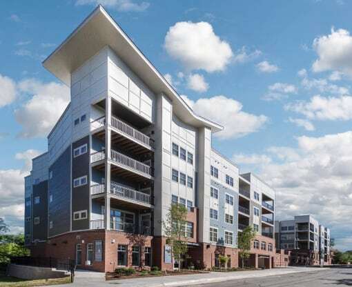 a new apartment building on the corner of a street