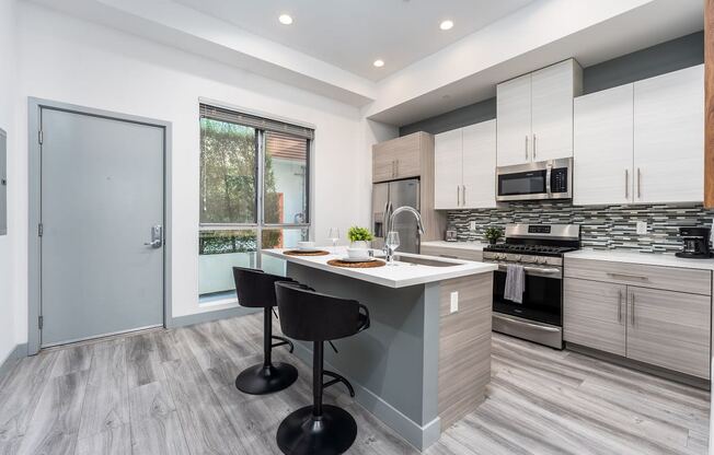 a kitchen with a counter top and a sink
