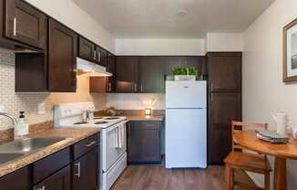 This is a photo of the kitchen of the 590 square foot 1 bedroom, 1 bath model apartment at The Biltmore Apartments located int he Vickery Meadow neighborhood of Dallas, TX.