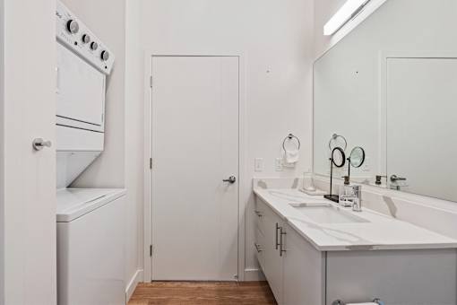 a white kitchen with a sink and a refrigerator at SevenO2 Main Apartments, Salt Lake City, Utah