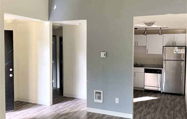 a view of the living room and kitchen from the dining room