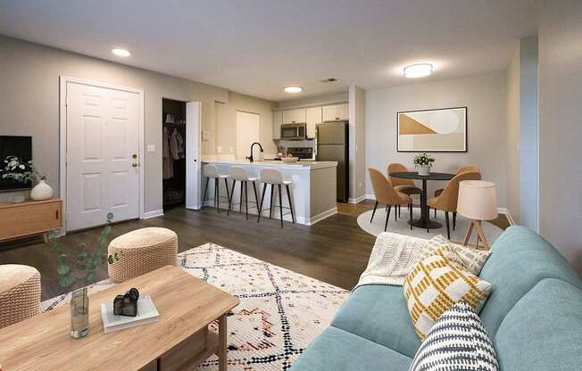 A living room with a couch, chairs, and a dining table.