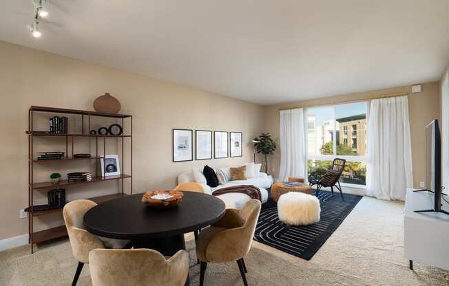 a living room with a table and chairs and a couch