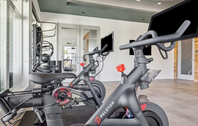 two exercise bikes in the gym at the belgard apartments