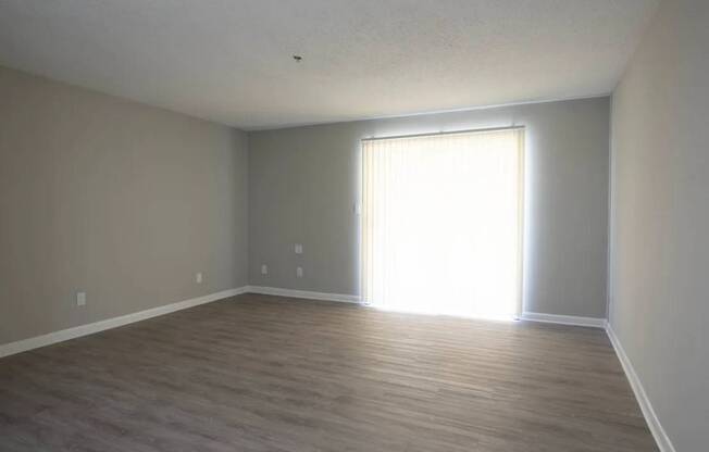 A room with light coming through a window.