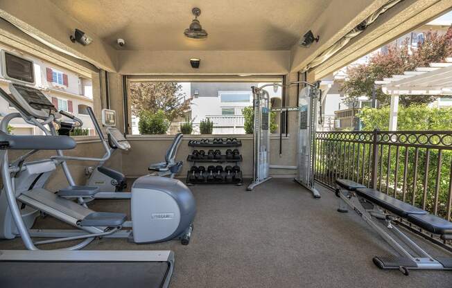 a fitness center with treadmills and other exercise equipment