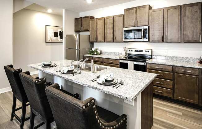 Luxury studio, one, and two bedroom apartment homes featuring granite countertops, stainless steel appliances, and fireplaces at East Lake Flats in Lincoln, NE