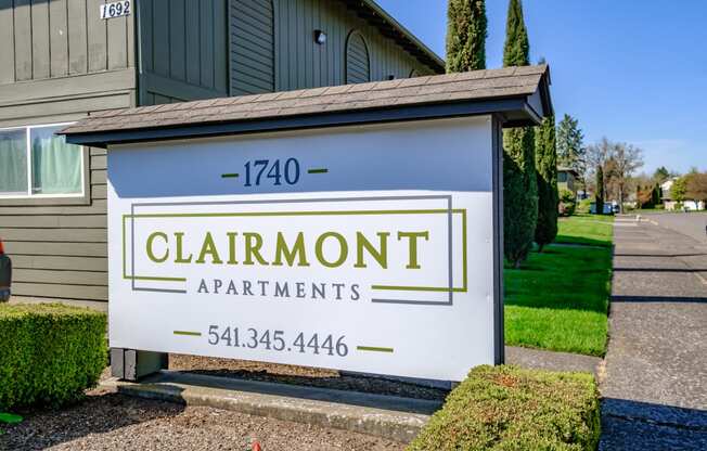 a sign for clairmont apartments