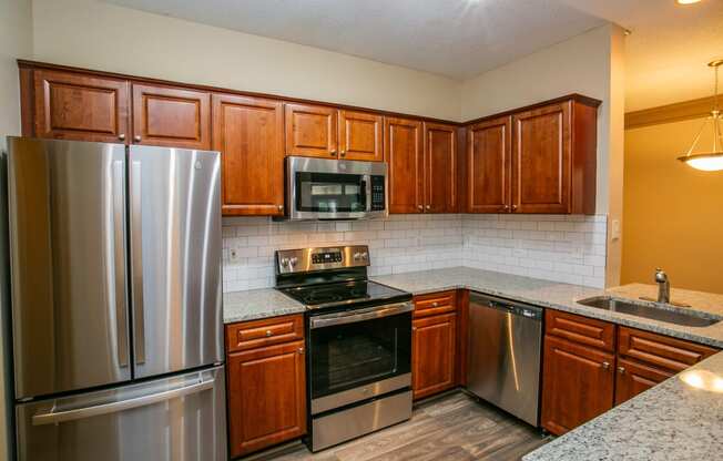 Full Kitchen with Granite Countertops at Best Rated Apartments in Atlanta