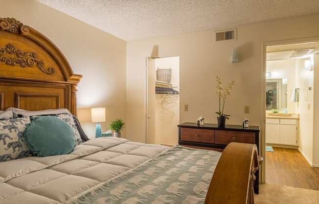 Riverstone bedroom with nice lighting, and carpet flooring