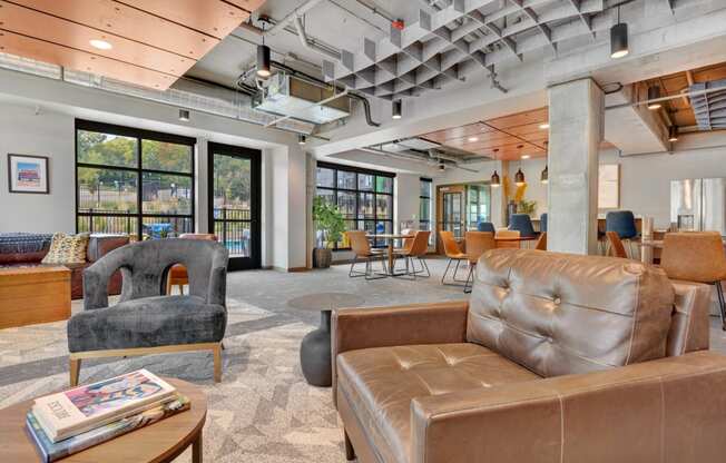 the lobby of a building with couches and chairs