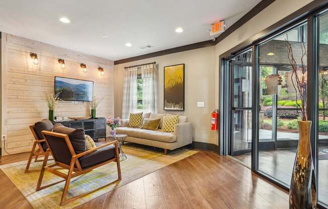 TV, couch and seats in resident lounge