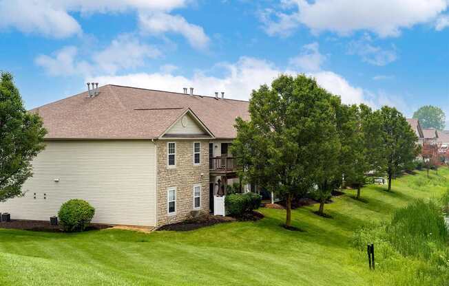 A house with a brown roof and a white garage door.